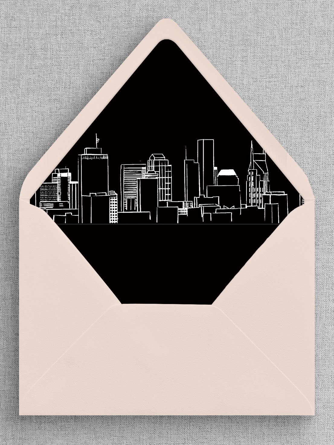 Open Pink Envelope Revealing Custom City Skyline Envelope Liner Sketch – Unique and Stylish Wedding Stationery