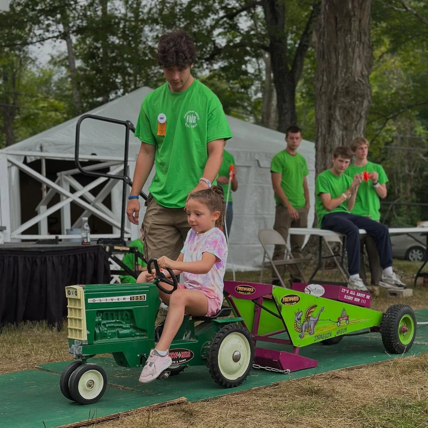 One of the kids favorite fair contests is kids pedal tractor pull! They take turns pulling down the track, slowly adding weight as they go!