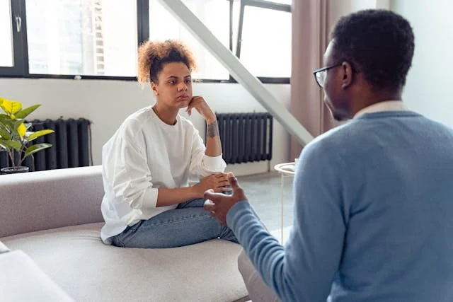 Therapist talking with client