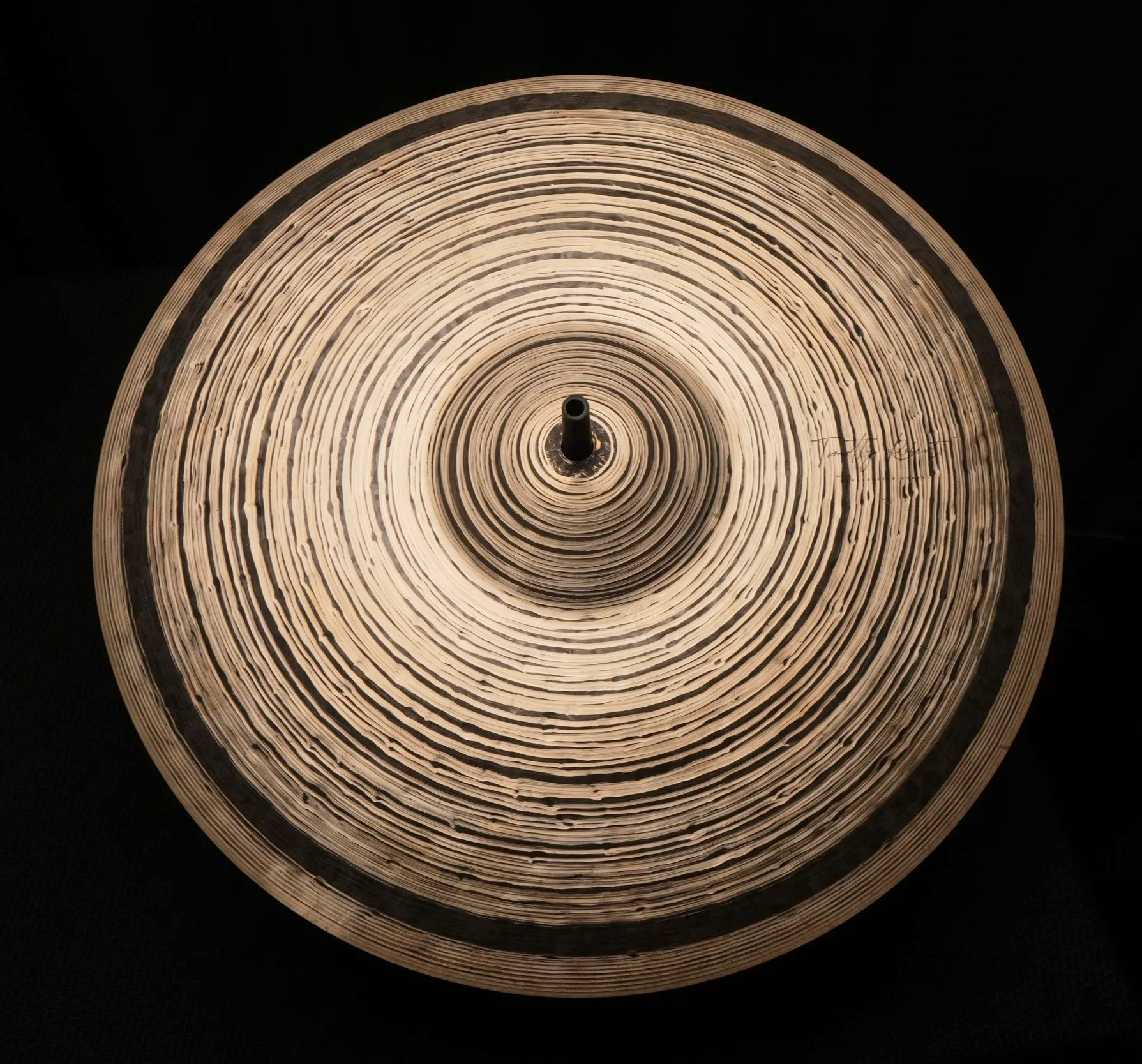 a cymbal on a black background