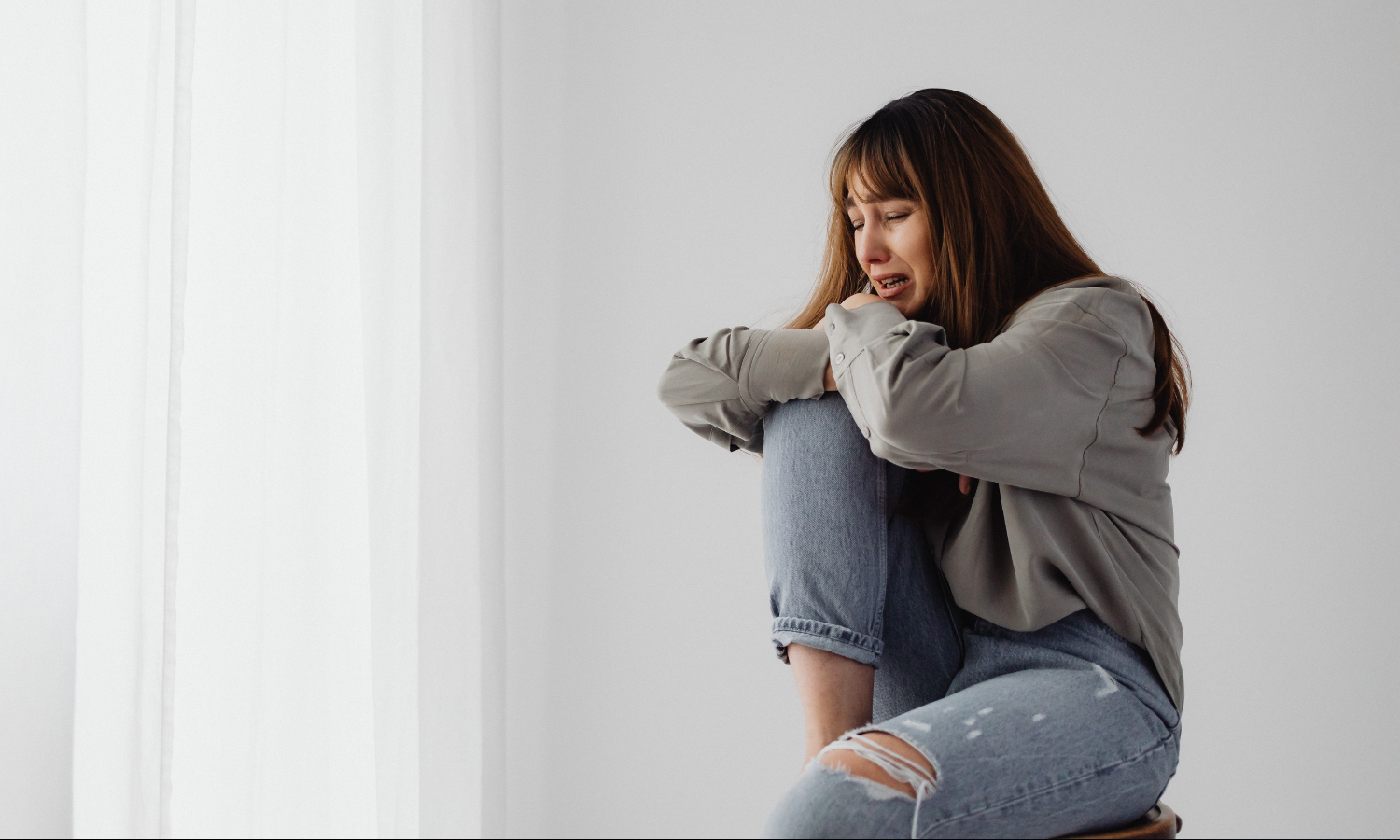 A woman experiencing heightened emotional reactivity as a result of her ADHD.