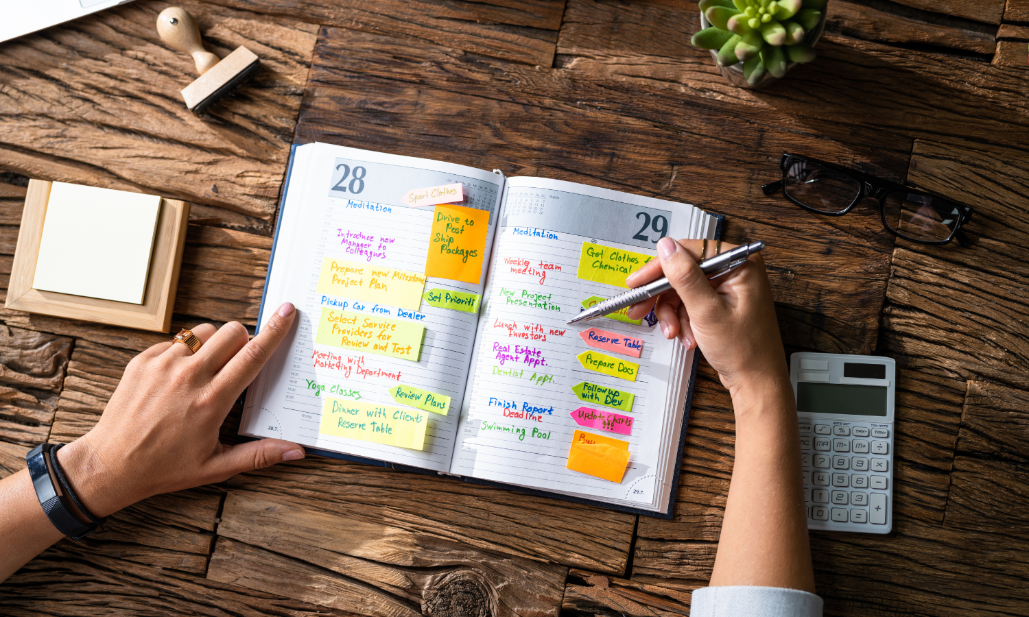 A man with ADHD planning his week in a planner to help him with strategise his week