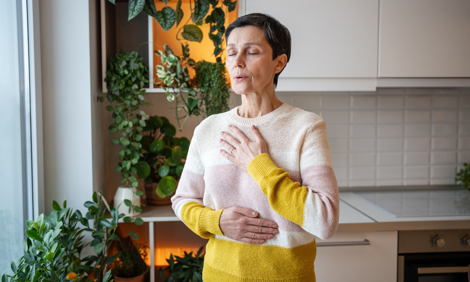 A woman with ADHD practicing emotional regulation techniques through deep breathing.