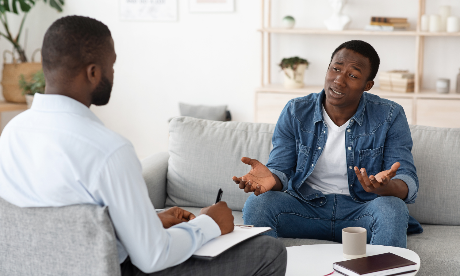 A man with ADHD talking to his coach about strategies and techniques he can use to help him learn how to be emotionally aware.