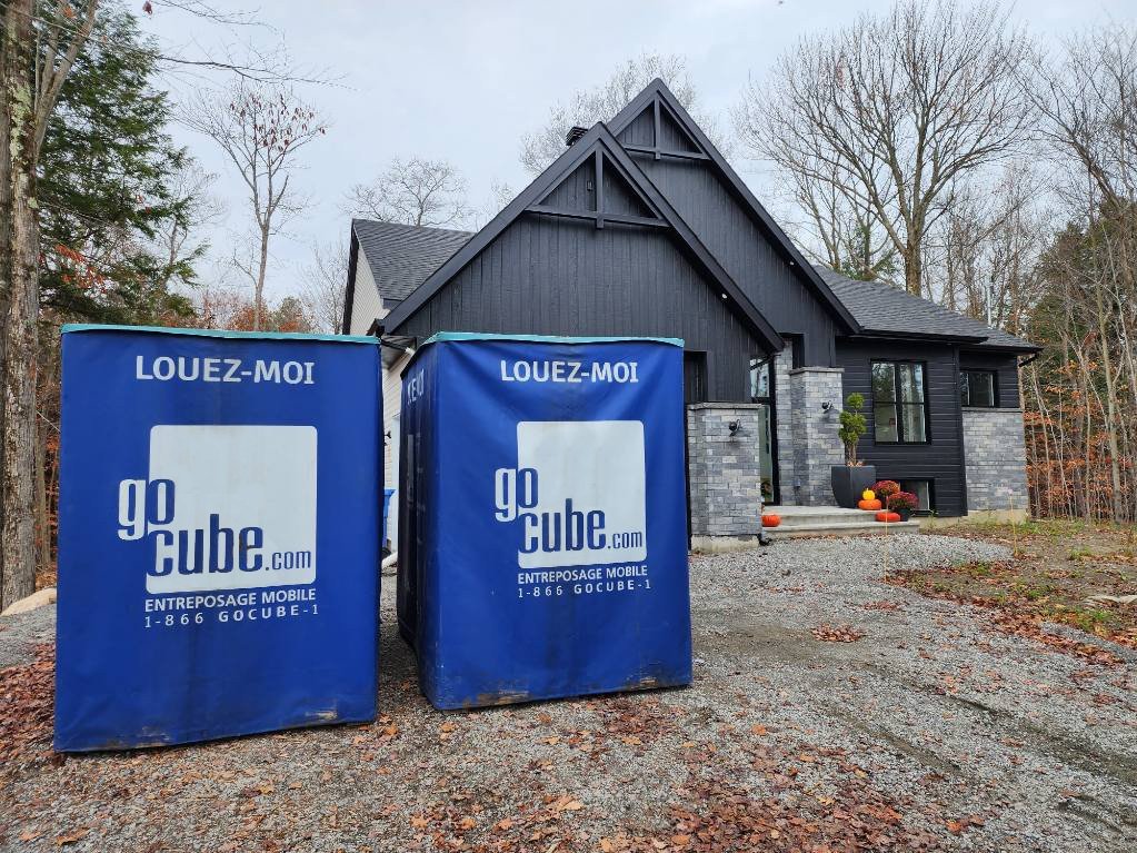 GoCube in front of a grey house