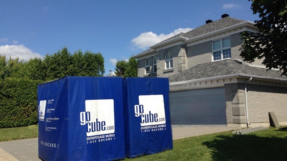 GoCube storage in front of a house in summer
