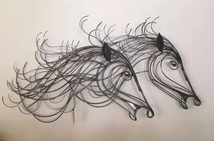 hand tinted chrome wall sculpture.jpeg