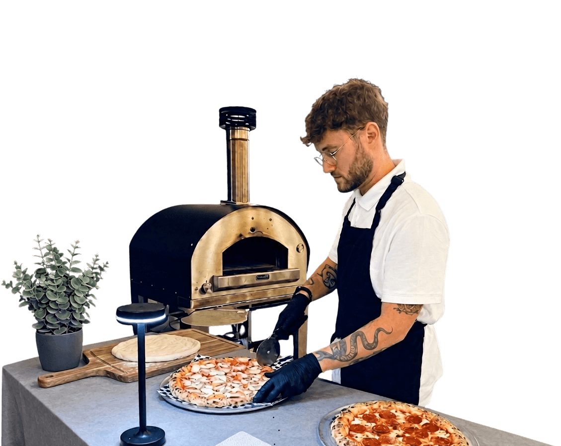 Artisan Neapolitan pizza cooking in a wood-fired oven for wedding catering