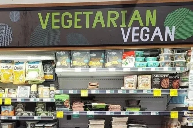 Reduced vegan product section in a supermarket in Los Angeles, showing how plant-based food shelf space has decreased compared to the peak expansion during the COVID-19 vegan boom.