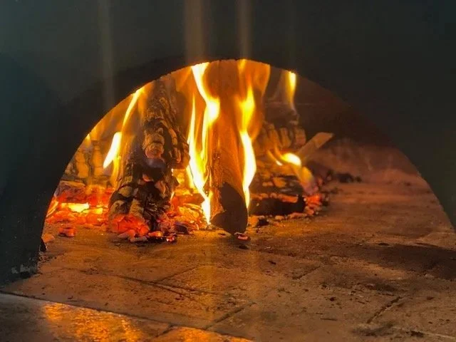 wood fired pizza oven in use for authentic Italian catering in Los Angeles