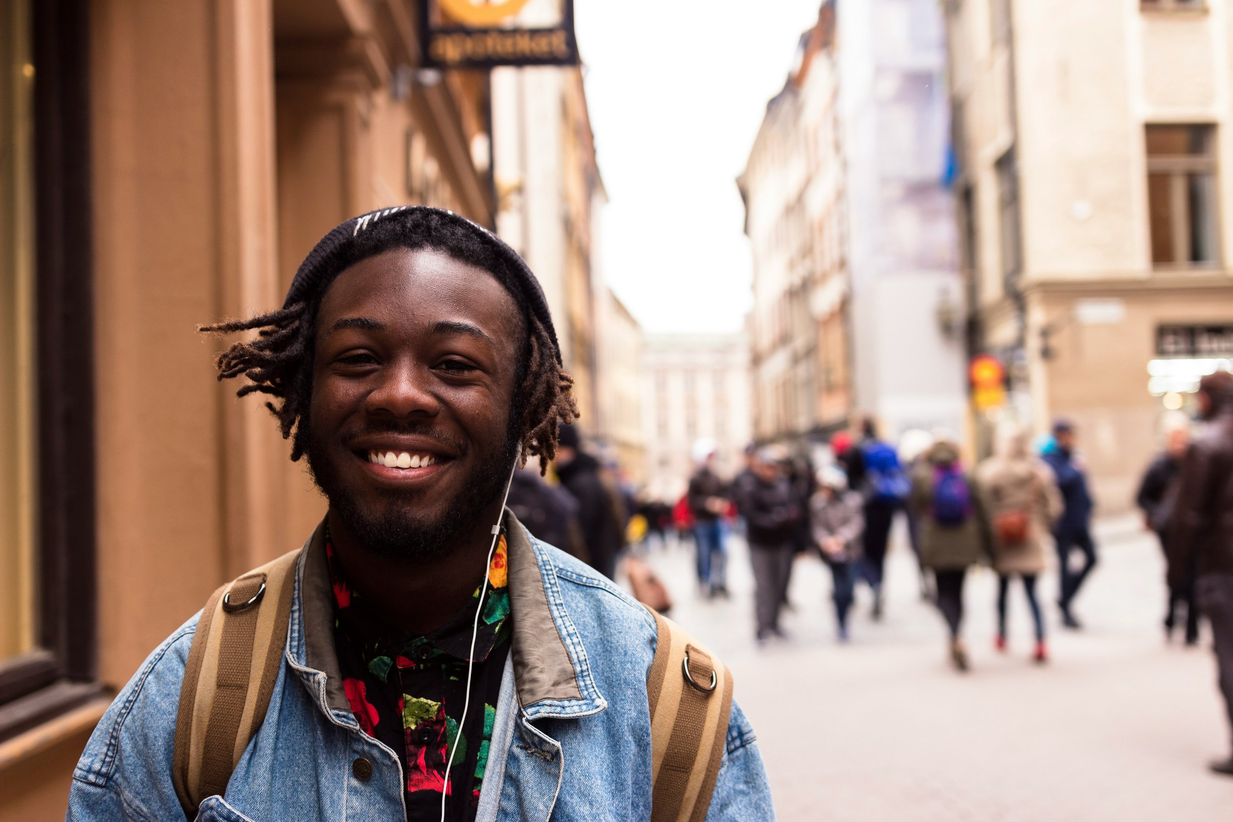 Teen boy walking on a sidewalk in the city