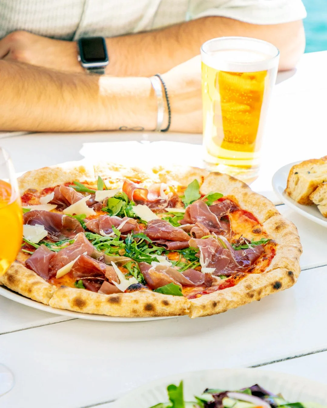 Made to order, wood-fired Prosciutto pizza with a schooner, what more could you ask for on a day like this.

#WoodFiredPizza #MadeToOrder #ProsciuttoPizza #FreshFromTheOven #SchoonerTime #PizzaAndBeer #StGeorgeSailingClub #WatersideDining #PerfectDay