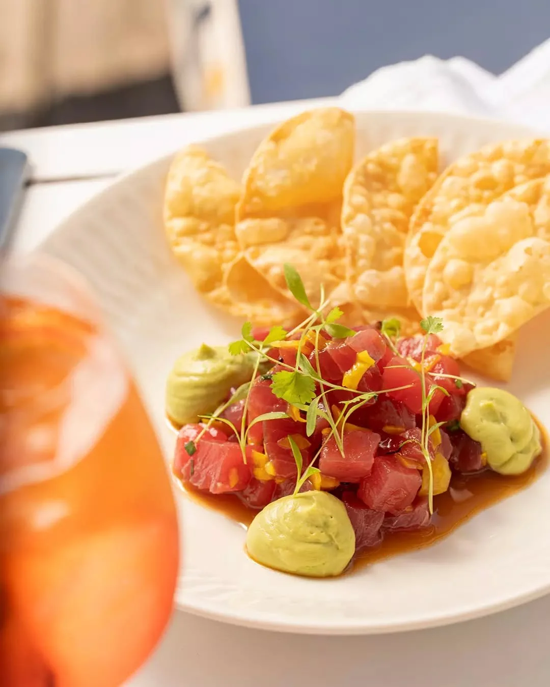 Tuna tartare with avocado, sesame, and crispy wonton. Fresh, vibrant, and the perfect way to start.

On the menu now.