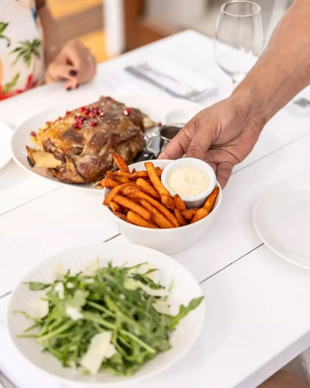 Slow-roasted lamb shoulder, golden sweet potato fries, and a sharp rocket parmesan salad.

Gather, unwind, and savour every bite. This is what weekends are for. This is the kind of long lunch that rolls into sunset, shared with mates, poured over a b