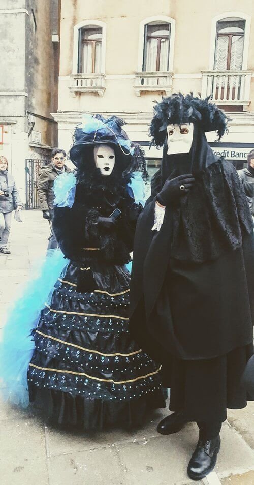 People in costumes at Carnaval in Venice, Italy