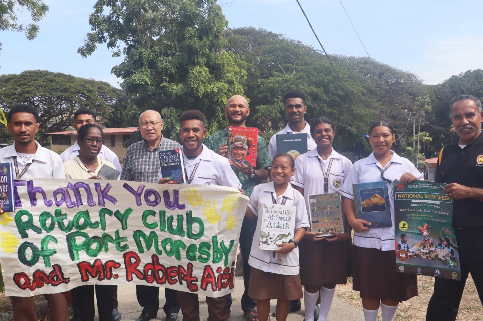 READ A BOOK, RESET YOUR FUTURE: ROTARY AND BUK BILONG PIKININI PUT BOOKS INTOTHE HANDS OF BADIHAGWA STUDENTS