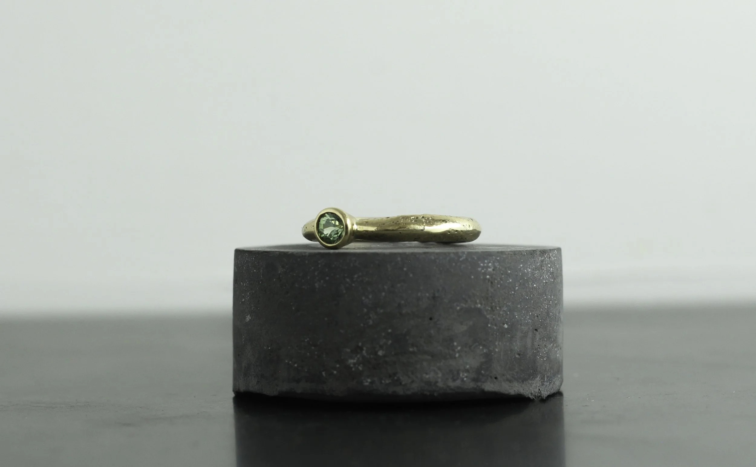 300 gold green saph solitaire left.jpg