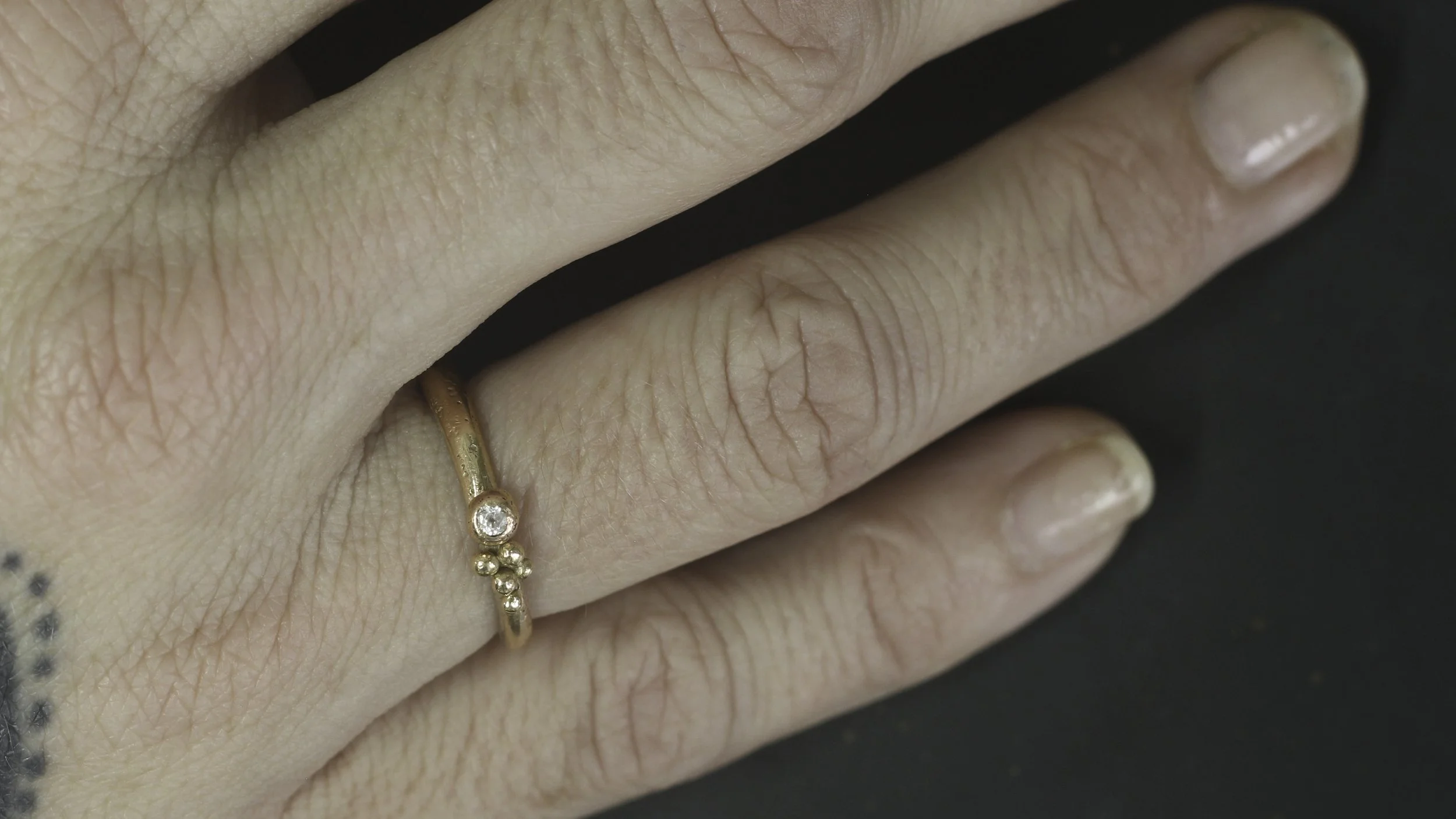 300_onhand_gold_diamondBarnacle solitaire.jpg