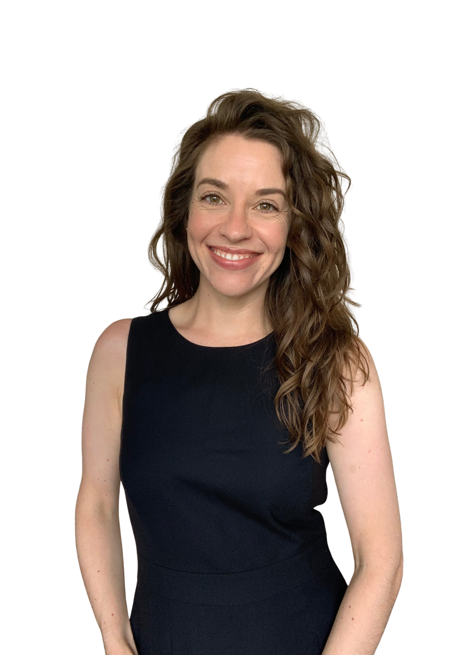 A woman with long, curly brown hair, smiling and wearing a sleeveless black dress, standing against a plain background.