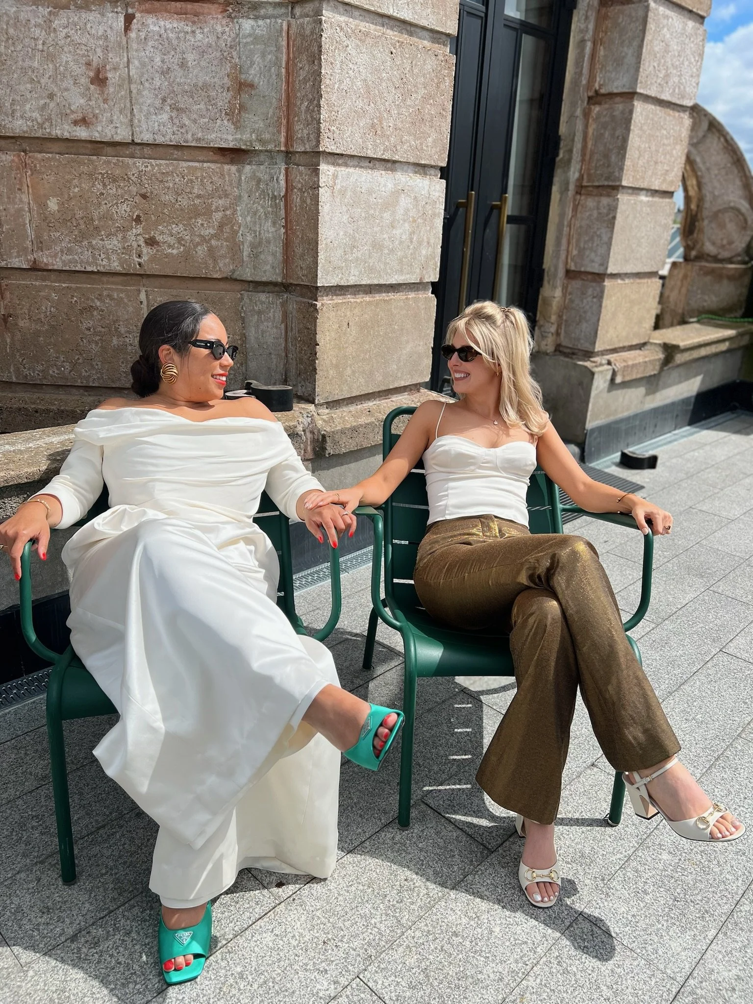 Two women celebrating their wedding day on a sunny rooftop in London