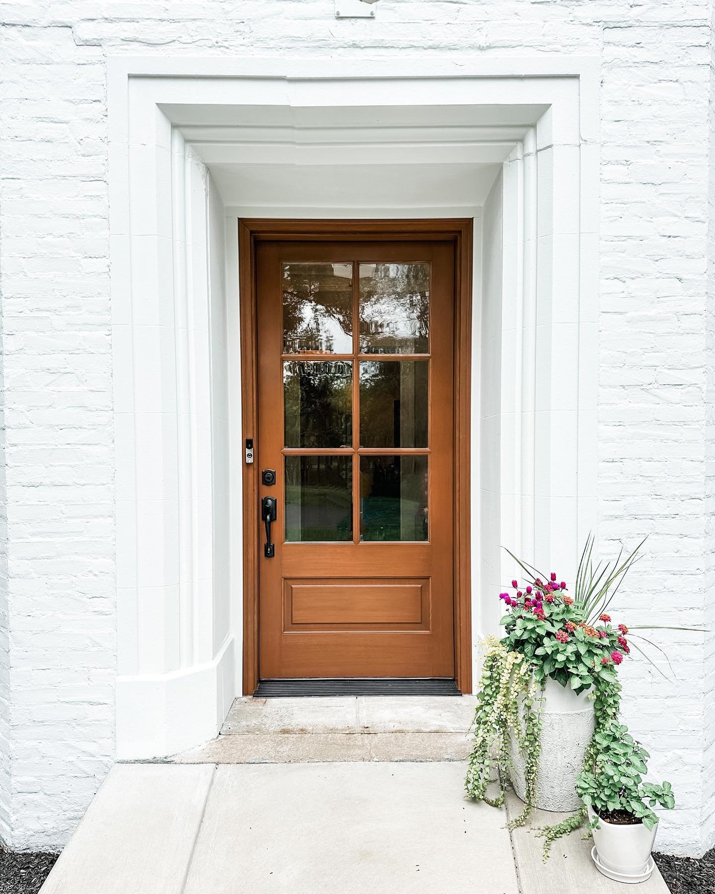 Is this front door a show stopper or what? Our client wanted help with their front door selection and to say it completely transformed the overall esthetic of their house is an understatement. Front doors are a major focal point of a house, so make i