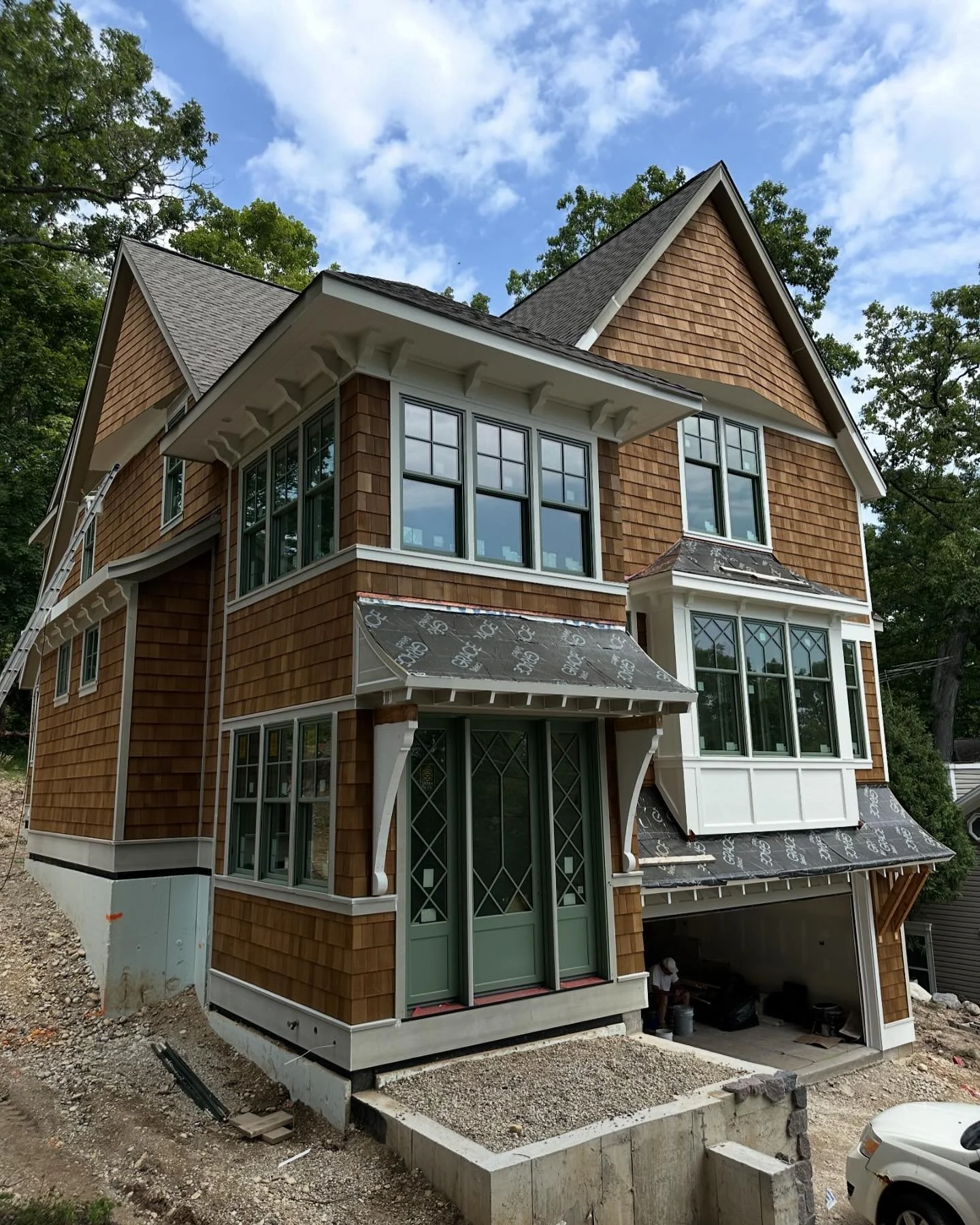 nothing but blue skies at our upper loch vista project 🍃

architect: @designonearchitects 
builder: @southshorecustomhomes 

#craftsman #craftsmanhome #residentialarchitecture #shinglehome #shinglestyle #copper #whitetrim #splitgranite #patinagreen 