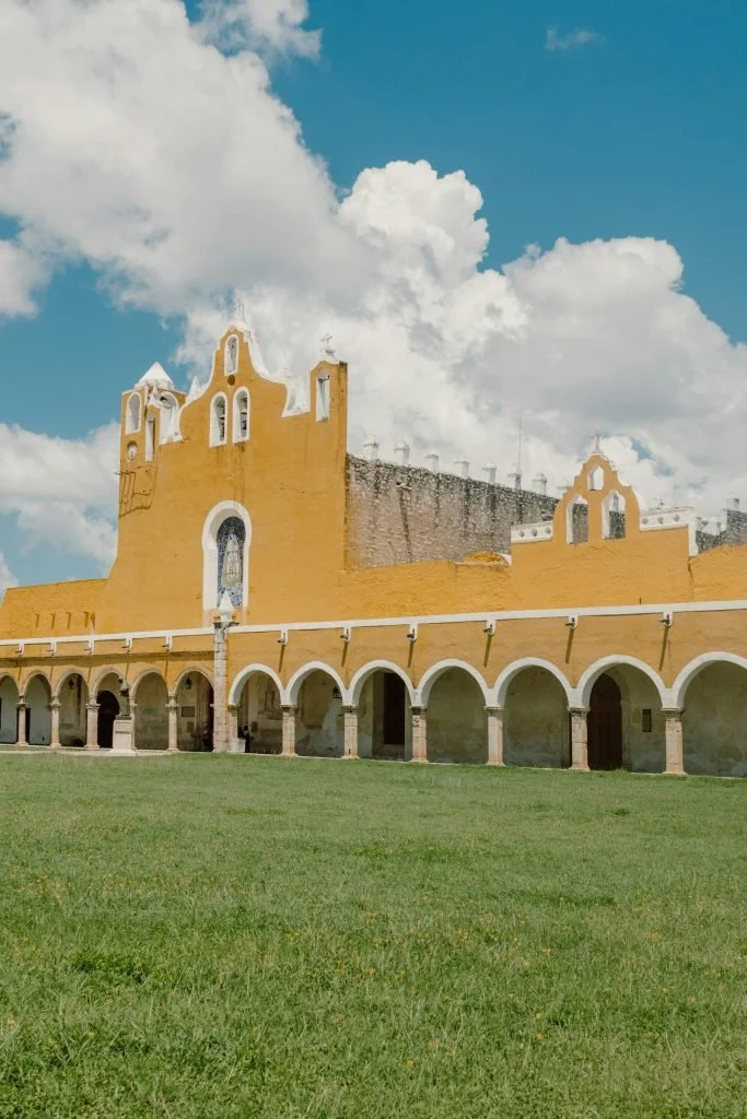 stunning-view-of-the-convent-of-san-antonio-de-padua-in-izamal-mexico-under-blue-sky.-13398452-scaled-683x1024.jpg