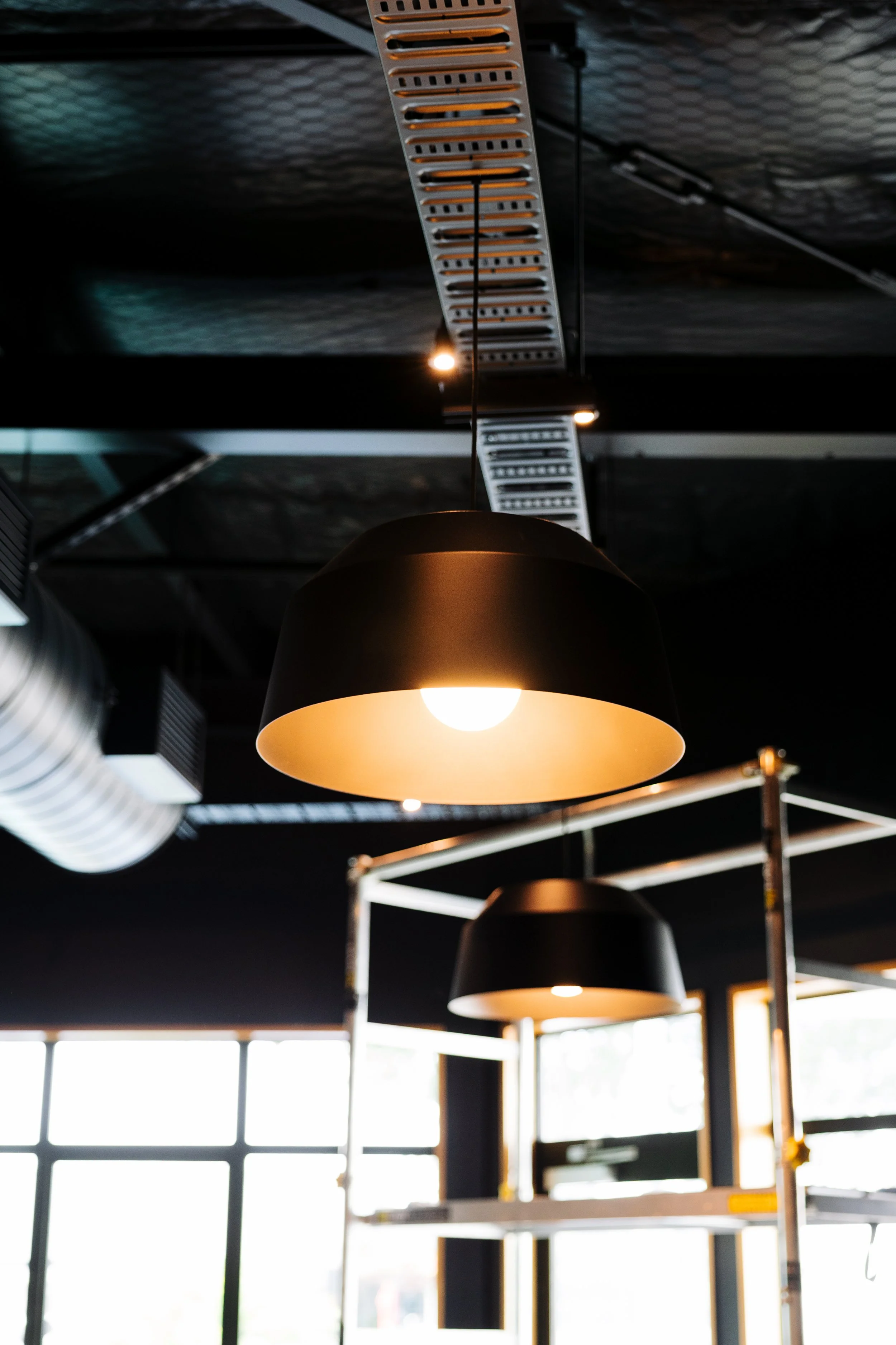 Pendant lighting and cable tray installed in a commercial fitout