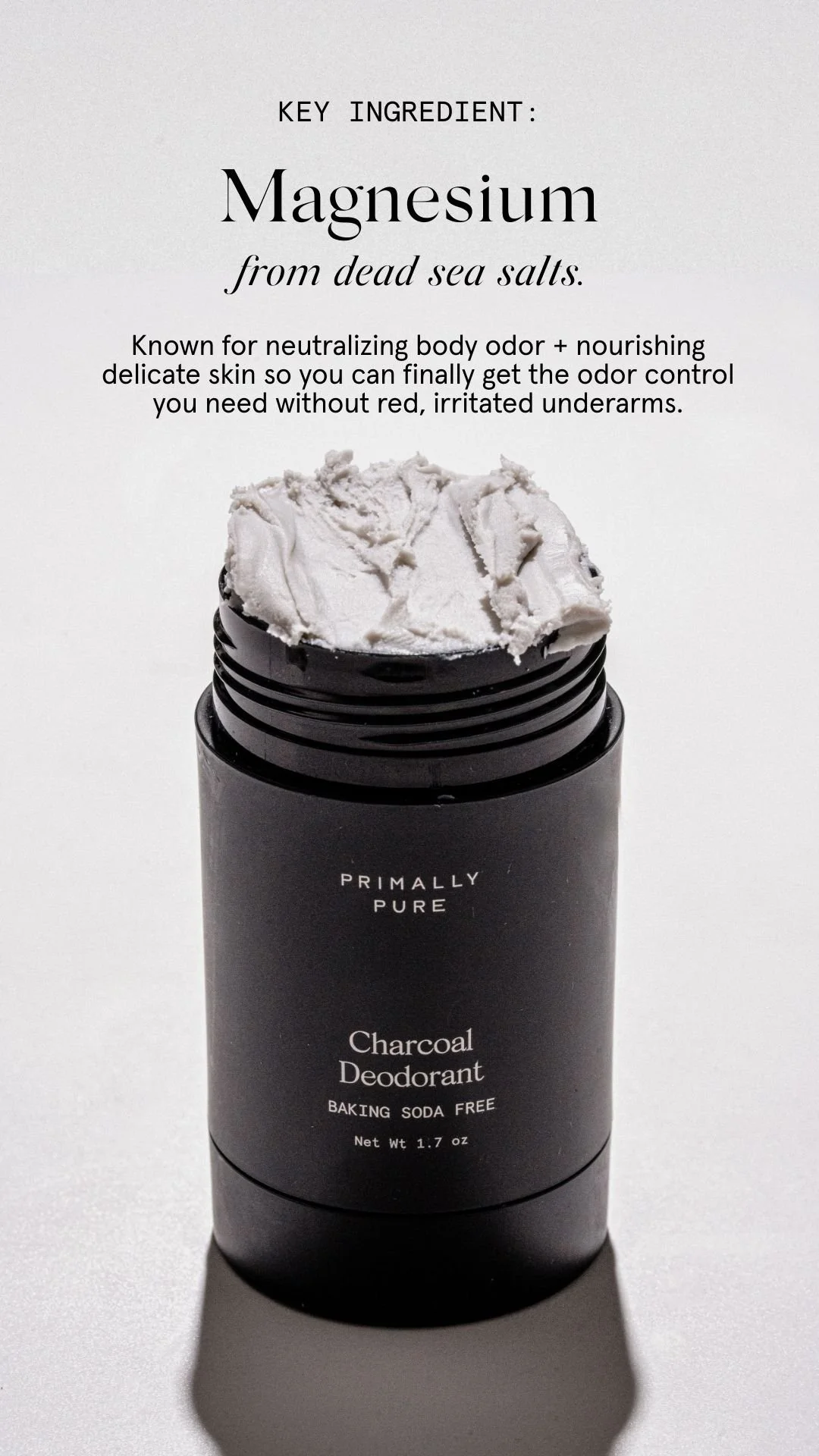 A black container of charcoal deodorant with a white top, placed on a white surface with a shadow. The label states it is baking soda free and weighs 1.7 ounces.