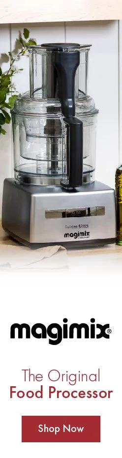 Food processor on kitchen countertop with a plant in the background and an advertisement for Magimix food processor below.