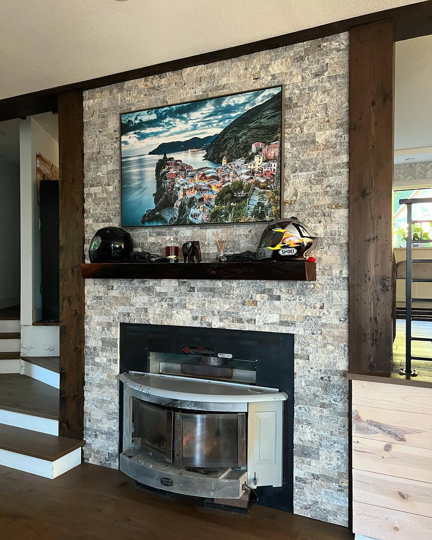 Stacked stone never looked better on a fireplace . 

#fireplace #stone #tile #design #cabin #outdoors #fire #helmet #bike #italian #homedecor #house #goals