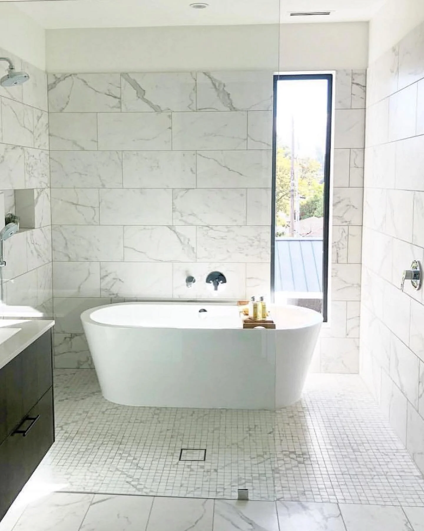 There was a time i built 9 identical bathrooms like this. Boy was those some hustling days. Very complicated job. Curbless showers with horribly framed houses. The room across was out of level by 3/4 . If you understand how to build curbless showers 