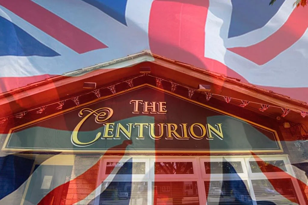 The exterior sign of The Centurion with a reflection of the Union Jack flag overlaying it.