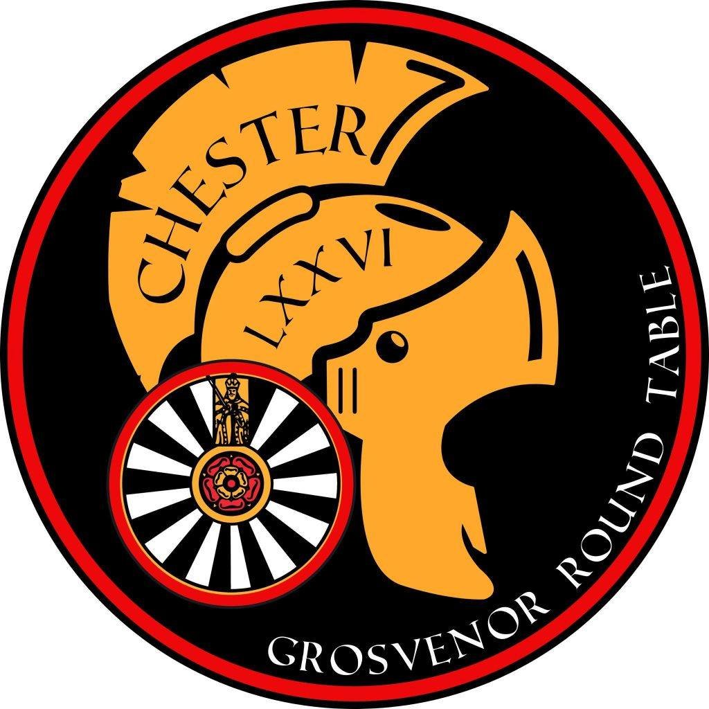 A circular emblem for Chester 7, Grosvenor Round Table, featuring a stylized knight's helmet, Roman numerals, and a shield with a Tudor rose, with black, red, and gold colors.