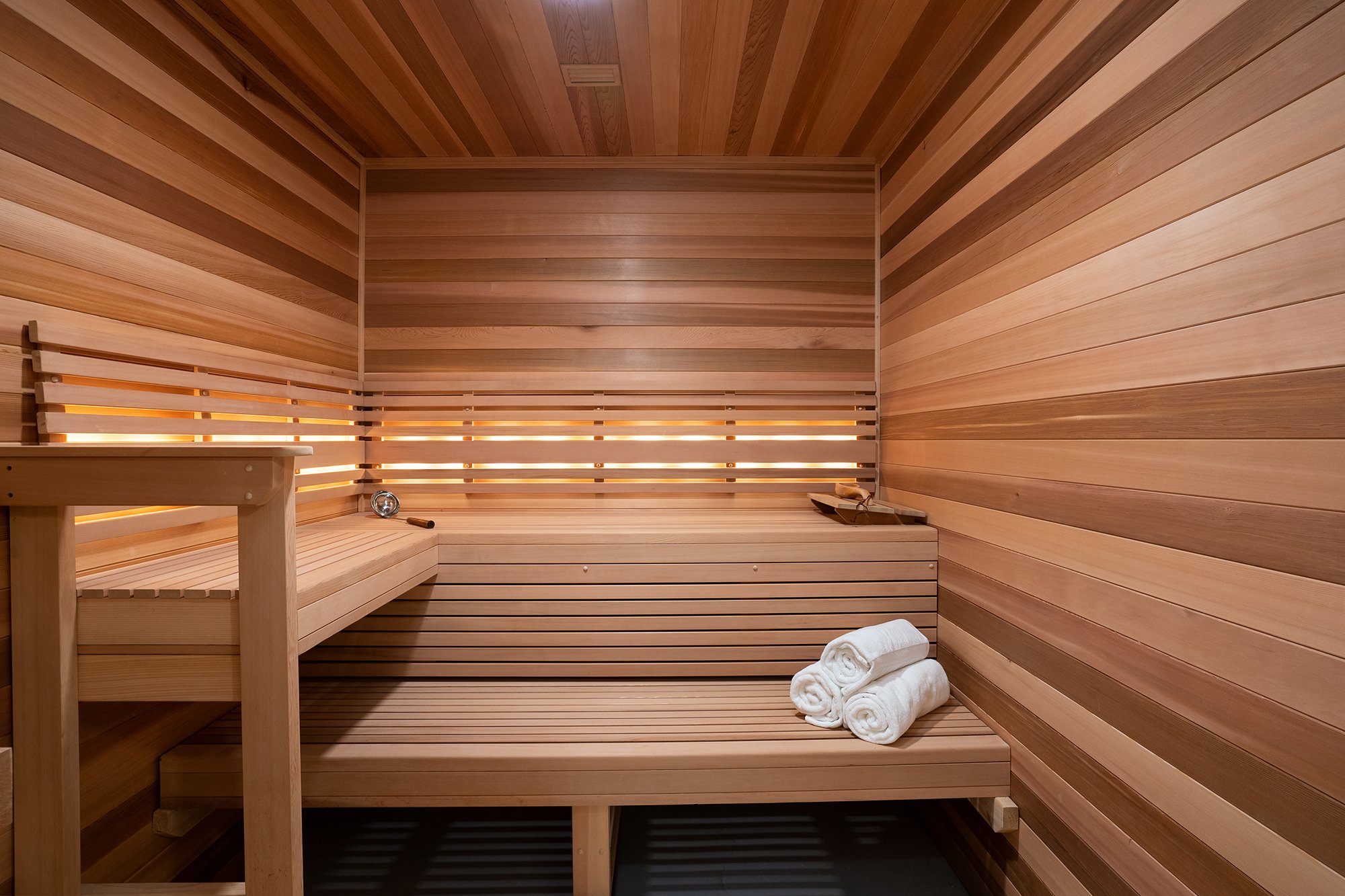 Tahoe Beach Club's spa features a modern wood sauna and fresh, white towels.