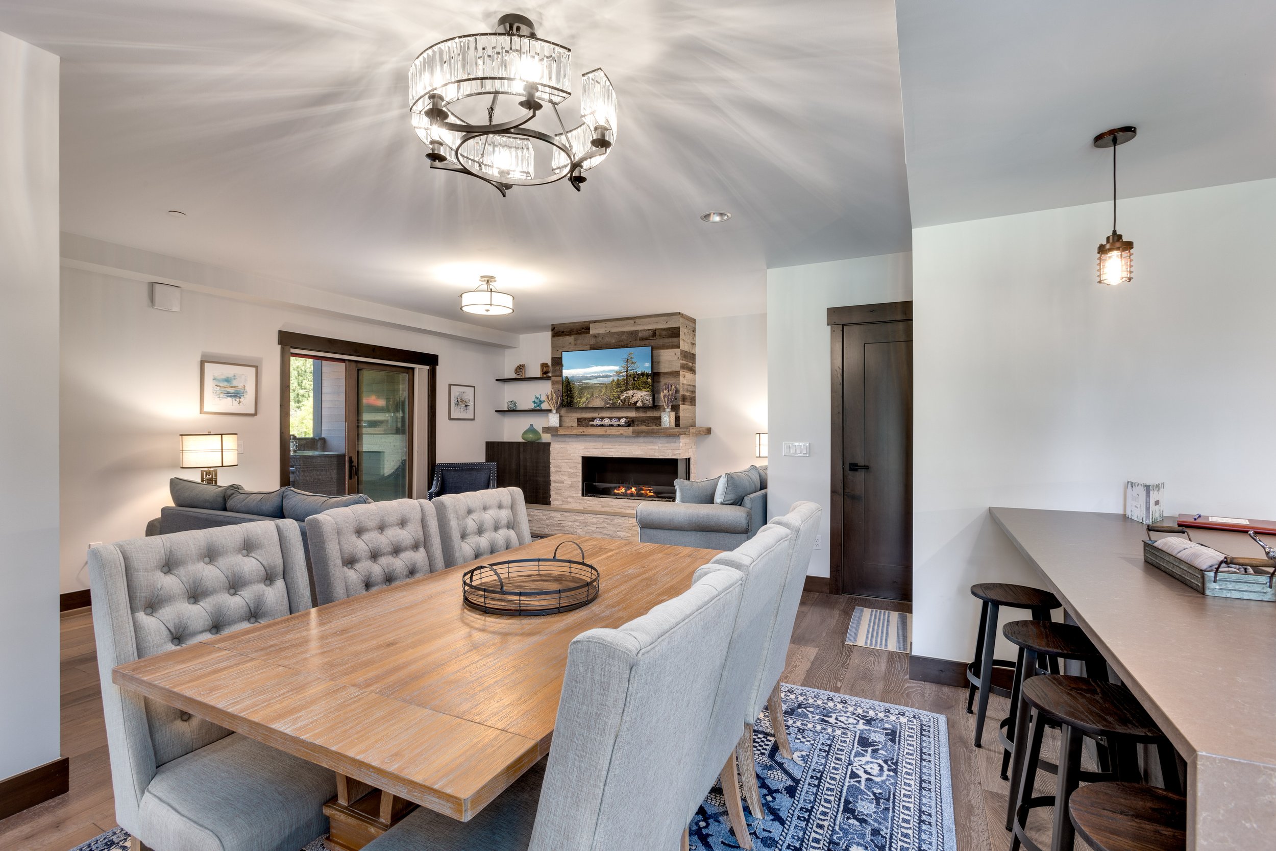 A spacious dining room in Tahoe Beach Club’s vacation rental with a long table and comfortable chairs.