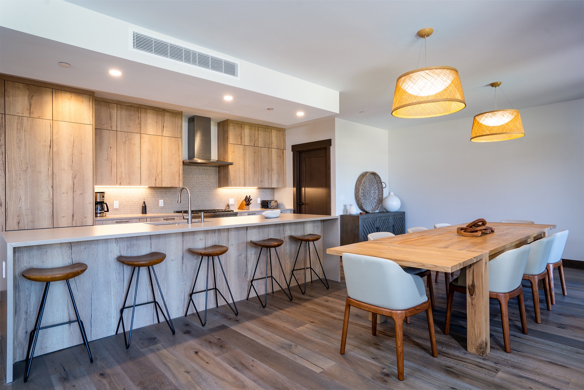 Tahoe Beach Club’s vacation rental kitchen and dining room with warm wooden floors.