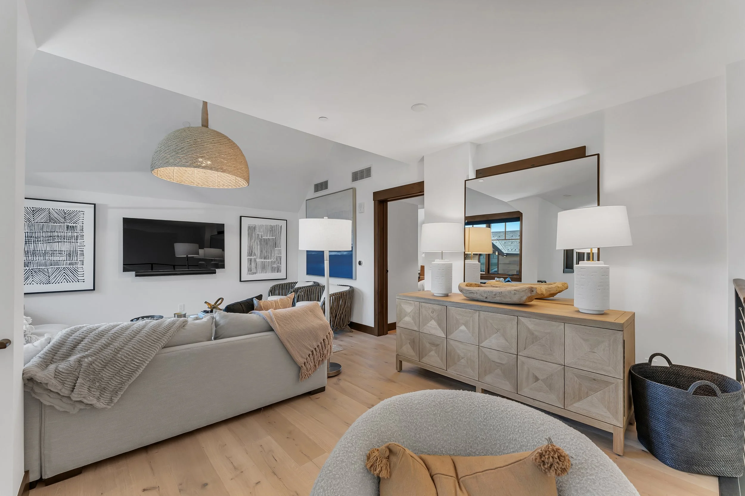 Residence 507 features a spacious loft retreat with a cozy living area, offering a television and generous seating for relaxed gatherings, entertainment, or quiet moments at home.