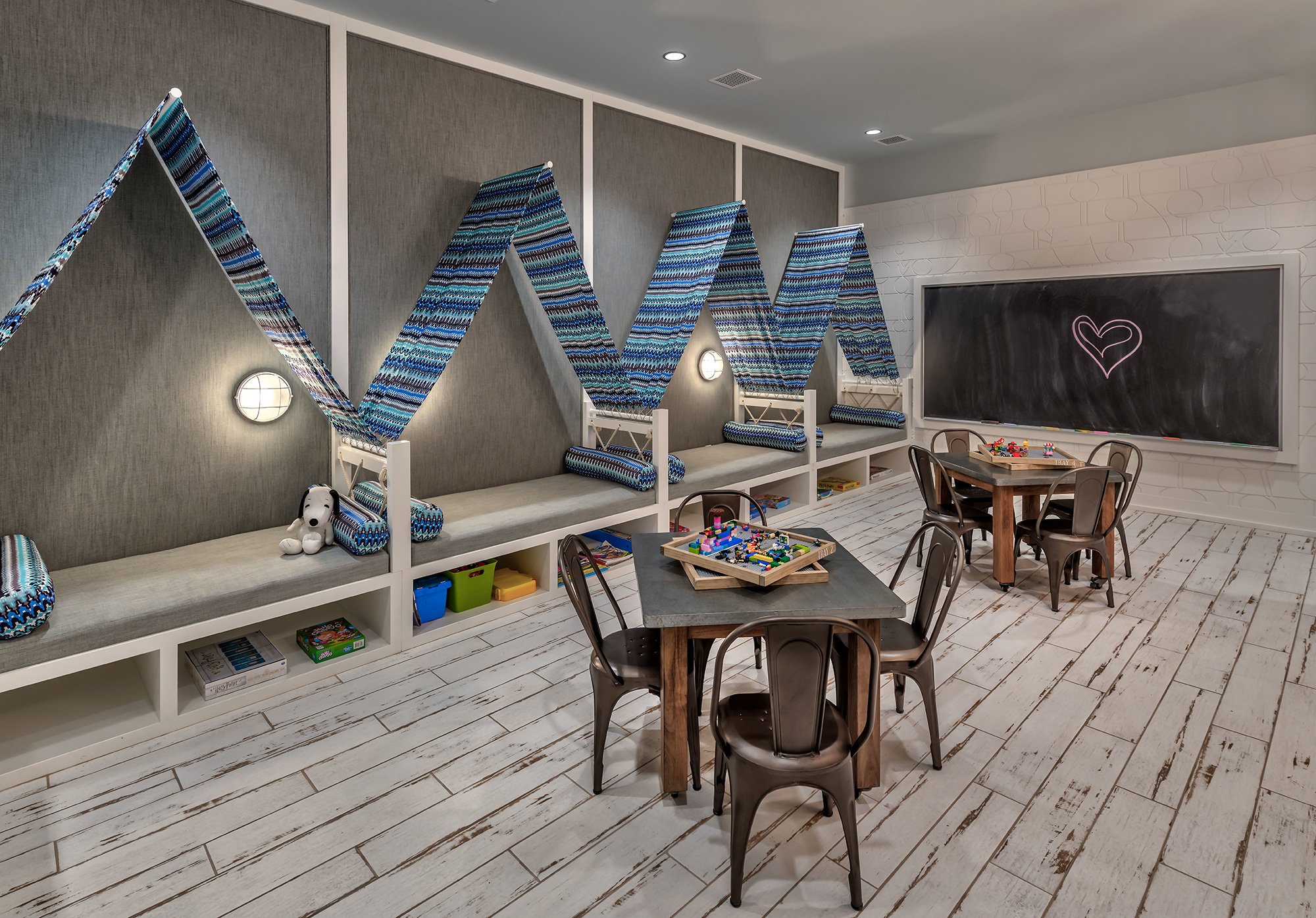   A lively playroom at Tahoe Beach Club is equipped with toys, games, and cheerful decor, providing a fun and engaging space for children.