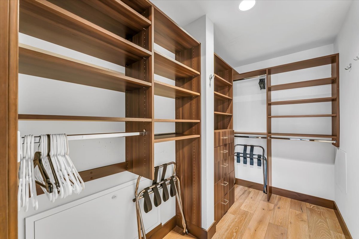Large walk-in closet with custom shelving