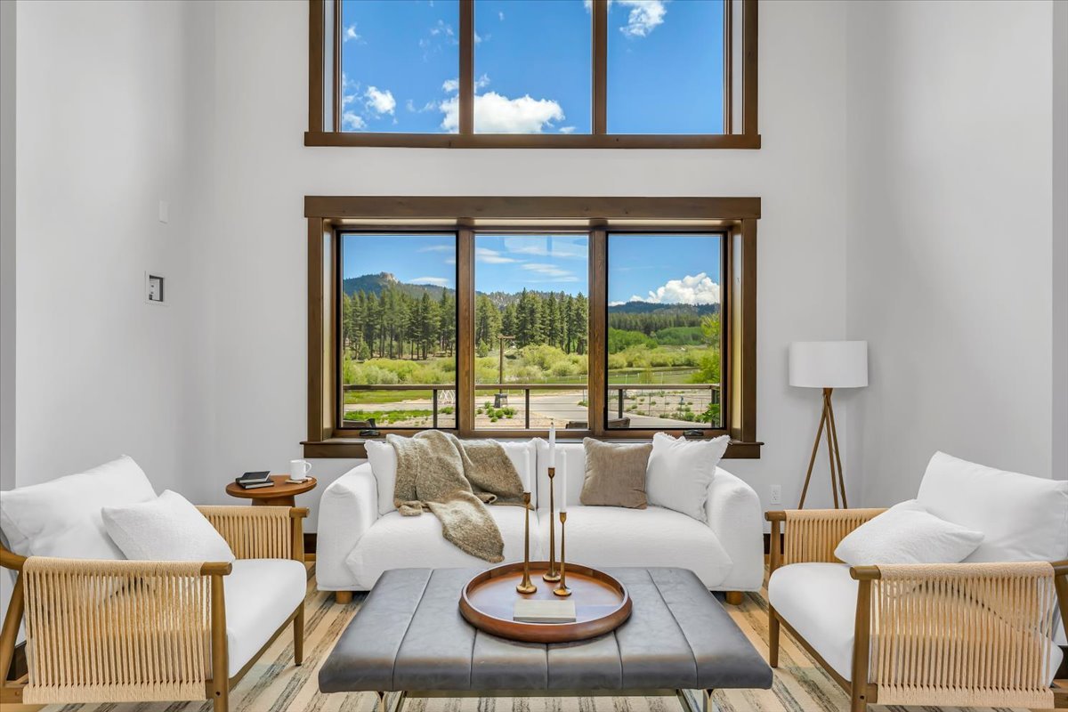 Elegant Tahoe Beach Club living area featuring contemporary architecture, soaring ceilings, natural light-filled windows.