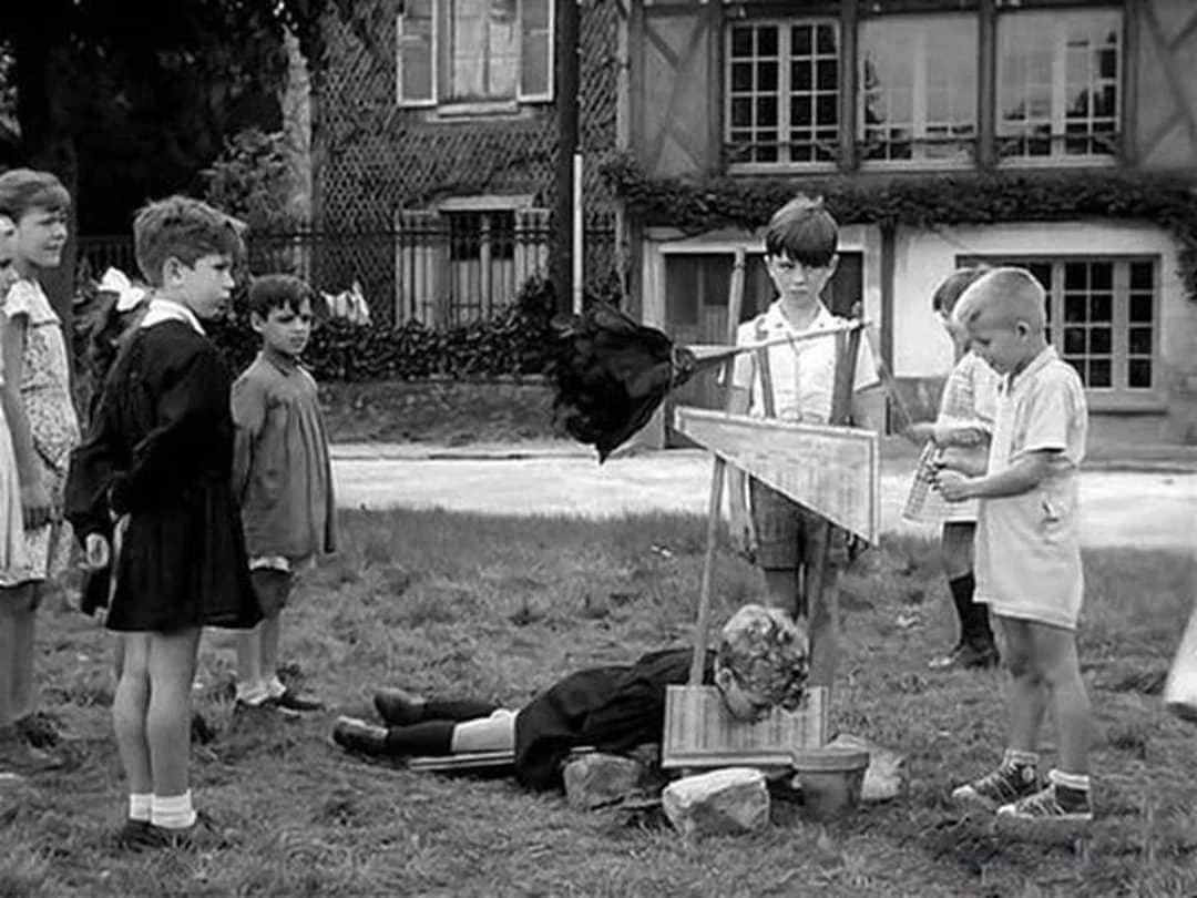 Children playing with guillotine 