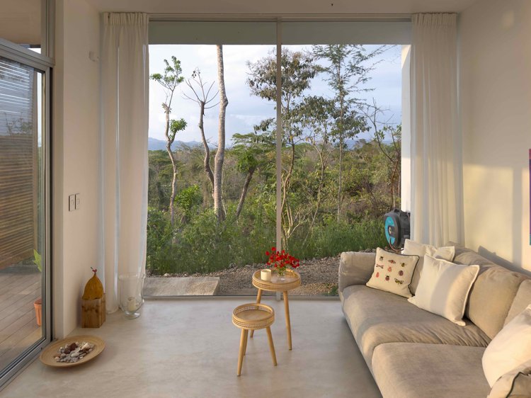 Living+room+of+Casa+Lilith+with+teak+finishes+and+open-plan+design.jpeg
