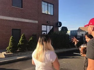 Left to right: Kathy, Tran, and Tony (Photo: Tam)   Art Team decided to go outside to talk more on how the mural could be assembled on the wall!