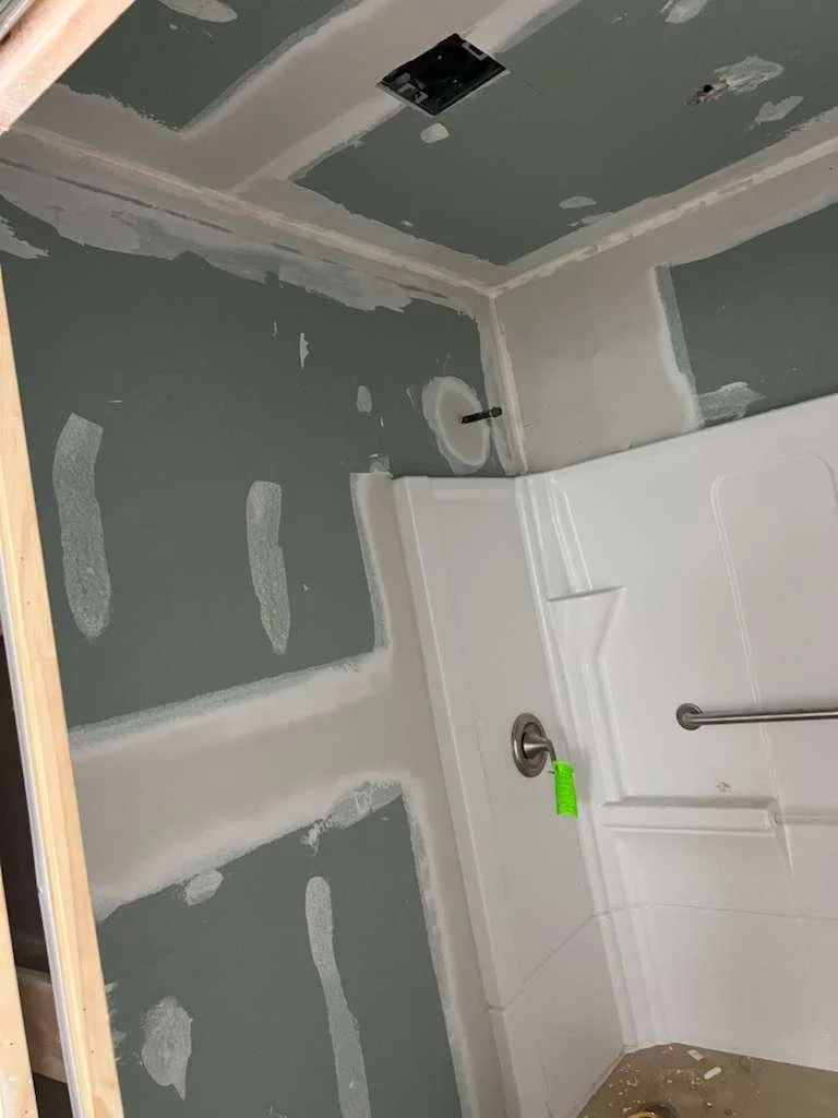 “Drywall repair and paint preparation in a Richmond bathroom”