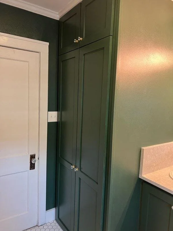 Freshly painted green cabinets with spray finish in West Houston, Texas