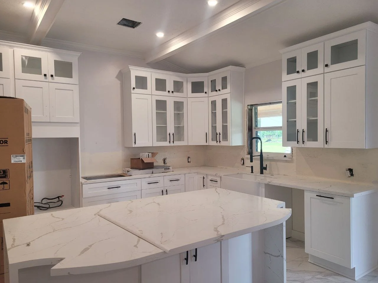 Freshly painted large kitchen cabinets with spray finish in Fulshear, Texas