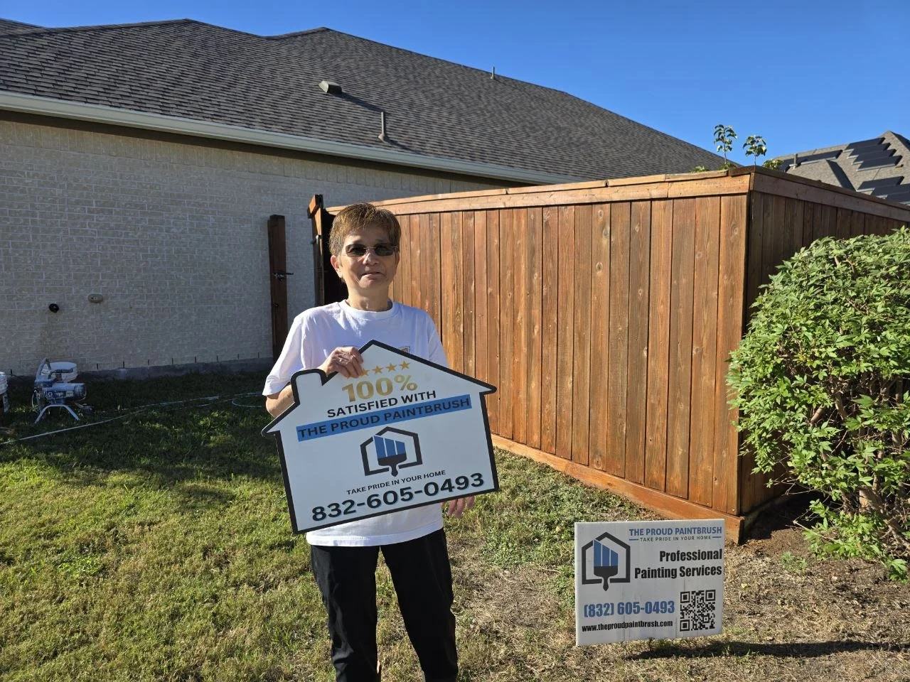 happy customer 100% satisfied with her freshly stained fence in rosenberg texas