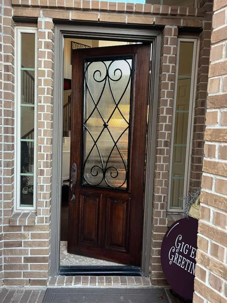Freshly stained and refinished mahogany front door in Katy, Texas.