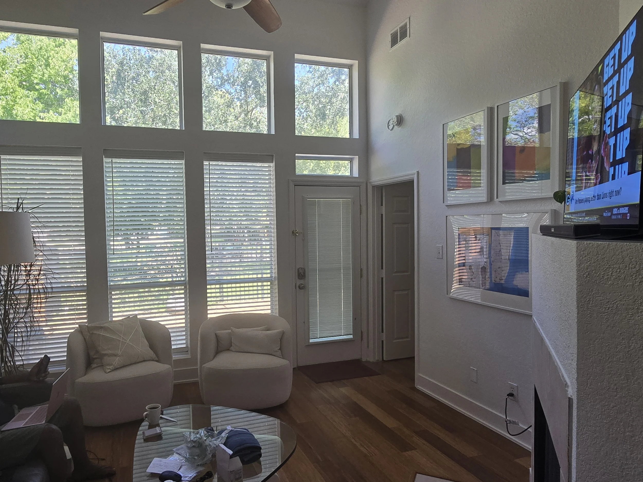 Bright living room interior painting project in a Sugar Land home with clean white walls and natural light